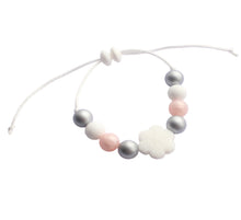 Load image into Gallery viewer, Snowflake bracelet with pastel-colored beads on a white background