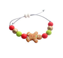 Load image into Gallery viewer, Colorful beaded bracelet with a gingerbread man charm on a white background
