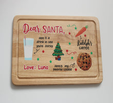 Load image into Gallery viewer, Wooden tray with Christmas-themed text and graphics on a white background